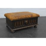 Oak footstool with worn leather upholstered top, 20 x 42 cm