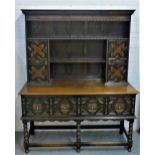 Oak Jacobean style dresser, with shelved plate back and cupboards over two long drawers to the