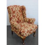 Upholstered wingback chair on cabriole legs, 100 x 85 cm