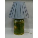 Green painted toile ware style table lamp base, complete with shade, size excluding fitting is