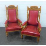 Pair of early 20th century oak framed open armchairs, with foliate carved top rail, upholstered