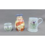Buchan pottery tankard together with a continental porcelain Scottish figural Toby jug (a lot)