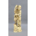 Japanese Meiji period ivory Okimono of a Bird Catcher standing on a rock surrounded by waves, signed