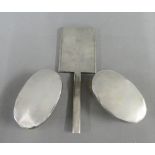A pair of Art Deco London silver backed clothes brushes and Birmingham silver hand mirror, (3)