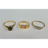 Gemset dress rings to include one 15 carat and two 9 carat gold (3)