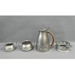 Archibald Knox Tudric pewter coffee pot, numbered 0307, together with English pewter cream jug and