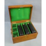 19th century mahogany case containing three leather covered glass hip flasks with Epns screw tops