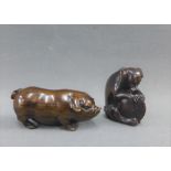 Two Japanese dark wooden Netsuke's to include a Dog and a Pig, signed, (2)