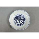 Chinese blue and white dish of circular form painted to the centre with two Phoenix's in flight,