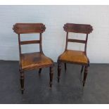 Pair of early Victorian mahogany library chairs with carved top rail, leather slip in seats and