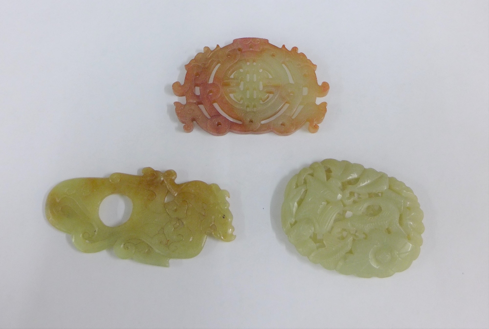 Collection of three carved jade plaques, largest 10cm (3)