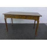 Whytock & Reid oak table, rectangular top over three short drawers, on cabriole legs with pad