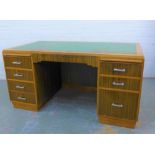 Early 20th century desk, the rectangular top with moulded edge and green skivver, over an