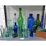 Quantity of coloured glass bottles (a large lot)