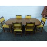 Mahogany dining table with two extra leaves together with a set of chairs with carved top rials