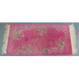Chinese wool rug, with pink field and dragon pattern, 164 x 70 cm