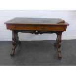 Victorian oak library table, the rounded rectangular top with leather skivver, above two frieze