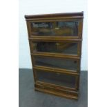 Oak Globe Wernicke four section bookcase / cabinet, with glazed up and over doors and a single