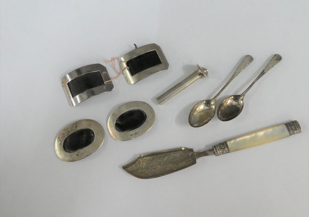 Mixed lot to include a Georgian silver and mother of pearl handled butter knife, silver buckles