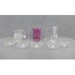 Collection of glass wares to include a cranberry glass jug, a decanter and stopper, a cut glass