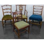 A collection of four 19th century mahogany side chairs to include two ladderback and one open