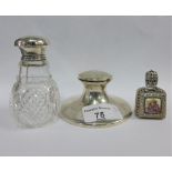 Silver desk capstan inkwell, silver topped glass scent bottle and a miniature white metal mounted