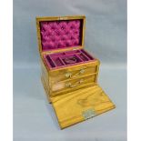Walnut jewellery box, the rectangular hinged top opening to reveal a fitted interior over two