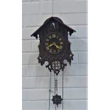 Carved wood cuckoo clock, main body 35 x 34cm, complete with weights and chains