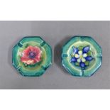Two Moorcroft floral patterned octagonal ashtrays with impressed back stamps, 11cm wide, (2)