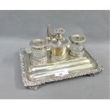 Silver plate on copper desk inkstand with two glass wells and central candlestick with candle