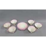 Belleek porcelain shell shaped teaset with pink rims, comprising six cups and six saucers with black