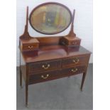 Mahogany dressing table with two jewel drawers and oval mirror above two short an one long drawer to