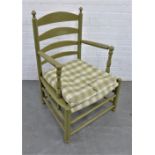 Scandinavian green painted wooden ladderback armchair, with turned finials and loose chequered