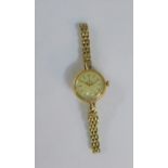 Lady's 9 carat gold vintage Tudor wristwatch with champagne dial, hour baton markers and