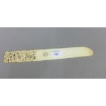 Late 19th / early 20th century Chinese ivory page turner with carved handle, 29cm long