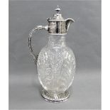 Epns mounted cut glass claret jug, with circular star cut base, 28cm high