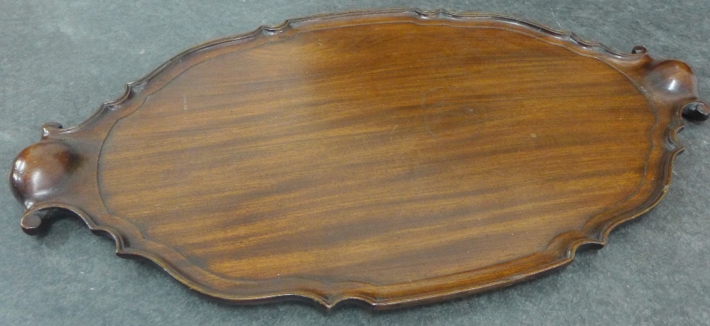 Large mahogany tray with moulded wavy edge