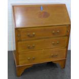 Mahogany and inlaid bureau with fall front, fitted interior, pull out slides and three graduating
