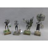 Four D'arcy Best novelty metal figures, tallest 21cm