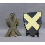 Heavy cast metal figure of St. Andrew, together with an ebonised saltire wall plaque, 21cm high, (2)