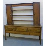 Oak dresser with three open shelves flanked by cupboards, over three frieze drawers, 194 x 185cm