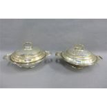 A pair of early 20th century silver plated serving dishes, with hammered finish and domed covers, (