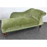 Green upholstered chaise longue / day bed with mahogany legs and brass castors, 80 x 165cm