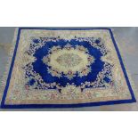 Large Chinese wool rug, the blue field with floral medallions, 305 x 244cm