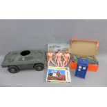 Box containing a collection of vintage Action Man toys with accessories