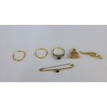 A collection of 9 carat gold jewellery to include a gemset dress ring, bar brooch, hoop earrings,