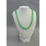 A strand of green quartz beads