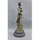 Bronze Art Nouveau female figure on a circular plinth base, signed Milo, 34cm high