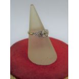 18 carat gold and platinum diamond ring, the central claw set diamond approx 0.5ct, flanked by