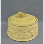 Wedgwood caneware game pie dish and cover with fruit and vine leafed pattern, impressed back stamps,